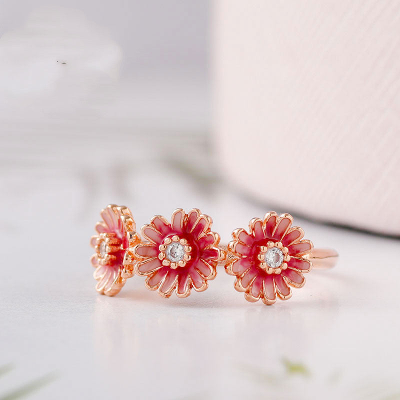 Three pink daisy rings